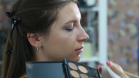 Makeup artist applying eyeshadow. Stock Footage 81942945