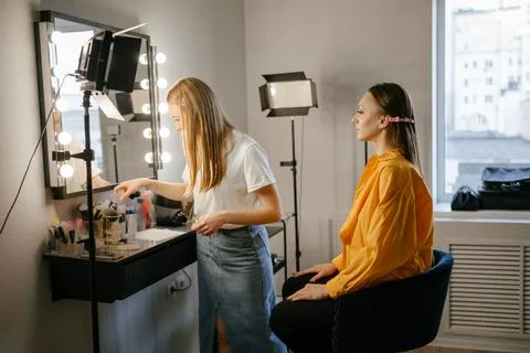 Makeup Artist Applying Foundation to Client in Salon Stock Photos