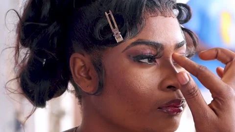 Makeup artist applying makeup foundation products on a woman's face. Stock Footage 217877318