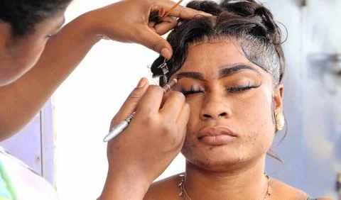 Makeup artist	Applying makeup paste on eyebrow. Stock Photos