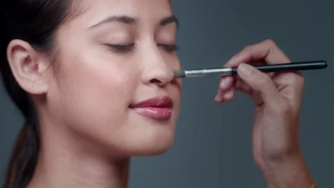 Makeup Artist applying Makeup to womans face. Stock Footage 90716246