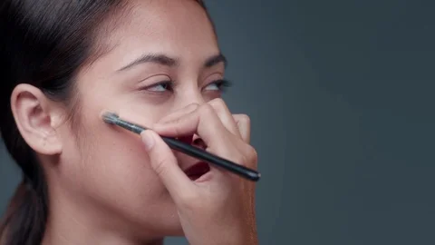 Makeup Artist applying Makeup to womans face. Stock Footage 90716867
