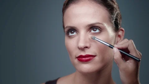Makeup Artist applying Makeup to womans face. Stock Footage 90723580