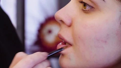 Makeup artist applying white eyeshadow Video stock 88537669
