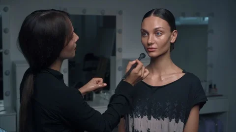Makeup artist appying foundation Stock Footage 111368660