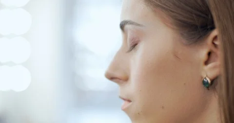 Makeup artist blending eyeshadows to model in beauty salon Stock Footage 126183251