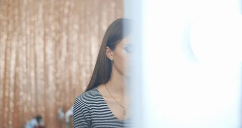 Makeup artist blending eyeshadows to model in beauty salon Stock Footage 126183819