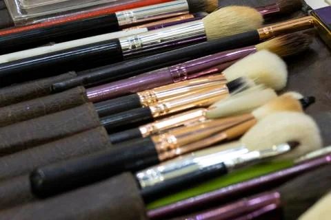 Makeup artist brushes. Background. Theme of fashion style. Stock Photos