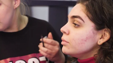 The makeup artist coloring eyebrow of the model Stock Footage 88536069