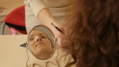 Makeup artist conducts a master class for young girl. Stock Footage 72622723