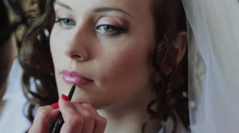 The Makeup Artist Does a Make-up to The Bride in the wedding day. Preparations Stock Footage 52490706