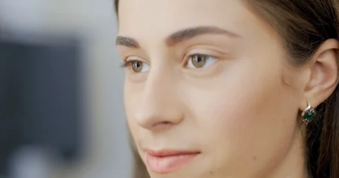 Makeup artist draws a model eyebrows with pencil Видео 126181941