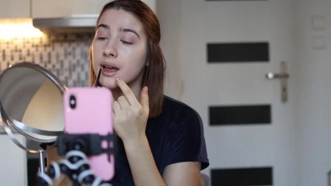 Makeup artist films lip tutorial Stock Footage 327217054
