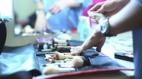 Makeup artist finishing the work and rubing her hands via cleanser. Stock Footage 60362013