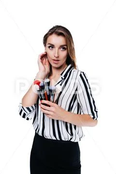 Makeup artist girl on a white background with brushes Stock Photos