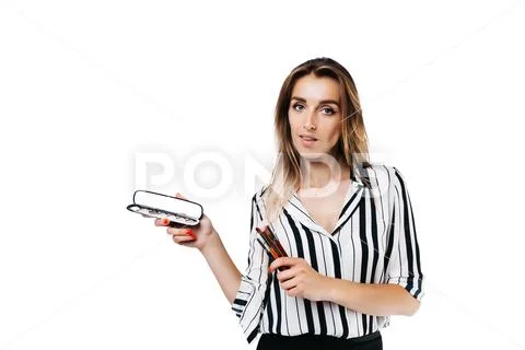 Makeup artist girl on a white background with brushes Stock Photos