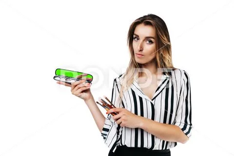 Makeup artist girl on a white background with brushes Stock Photos