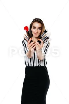 Makeup artist girl on a white background with brushes Stock Photos