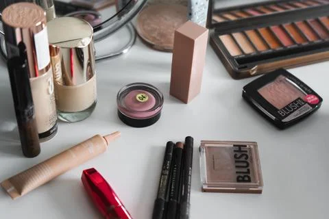 Makeup artist kit, eye shadow, foundation, powder, mirror, eyeliner pencils,  Stock Photos
