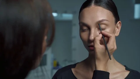 Makeup artist make eyebrows Stock Footage 111368088
