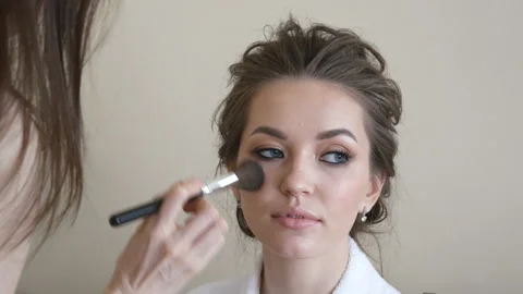 Makeup artist makes the bride make-up and hairstyle Stock Footage 101231035