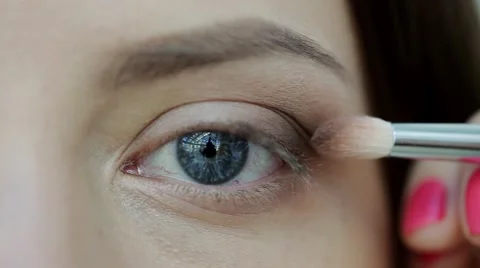 Makeup artist makes models eye makeup. Closeup Stock Footage 55886797