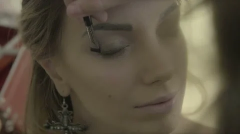 Makeup artist makes young beautiful bride bridal makeup Stock Footage 67962014