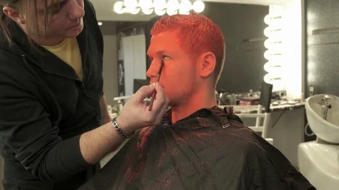 Makeup artist making art makeup with the brush Stock Footage 73538710