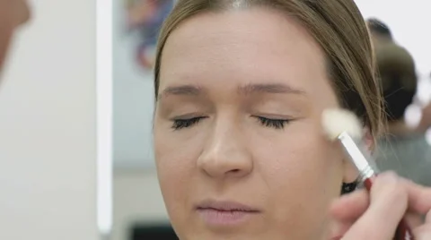 Makeup artist making make-up for young model Stock-Footage 63747425