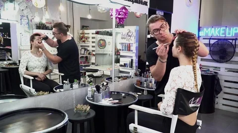 Makeup artist making makeup for a young bride Stock Footage 77237102