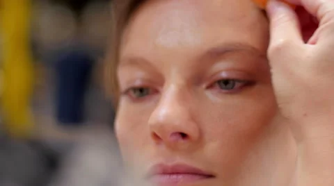 Makeup artist making up model extreme closeup Stock Footage 59729209
