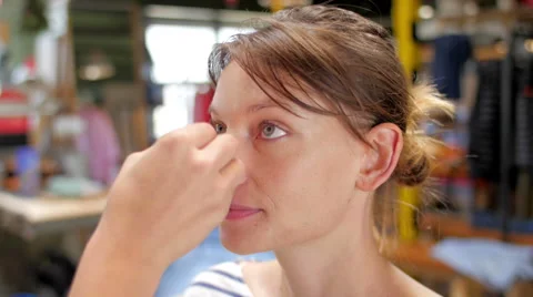 Makeup artist making up smiling and talking model closeup Stock Footage 59729820