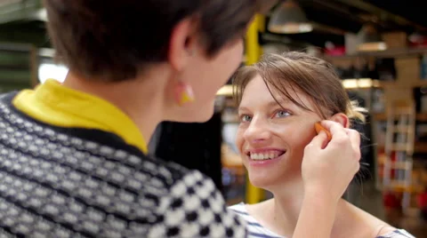 Makeup artist making up smiling and talking model closeup 스톡 동영상 59729890
