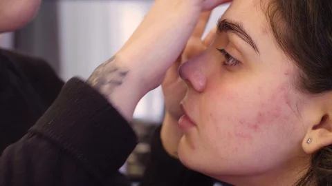 The makeup artist massaging face of the model Stock Footage 88535723
