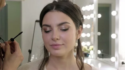 Makeup artist paints eyelash models in a makeup salon. Beauty face. Stock Footage 132601685