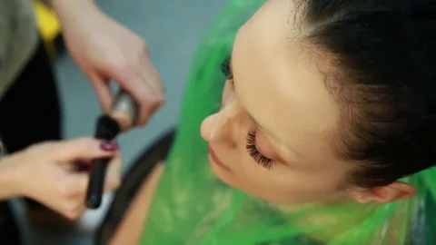 Makeup artist paints lips. Stock Footage 74350180