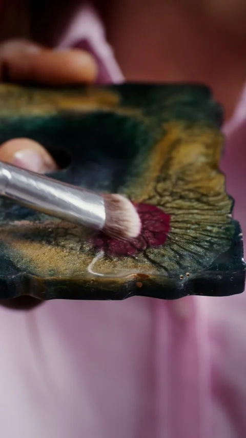 Makeup artist picks up paint from a palette - Model. Stock Footage 323966621