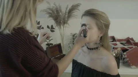 Makeup artist preparing bride before the wedding in a morning Stock Footage 67959143