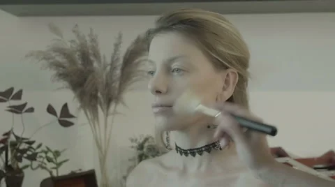 Makeup artist preparing bride before the wedding in a morning Stock Footage 67960871