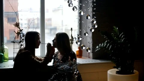 Makeup artist at the window doing makeup model Stock Footage 100854317