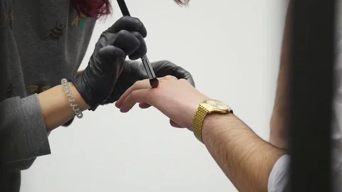 Makeup artist at work applying special effects makeup Stock Footage 83314959