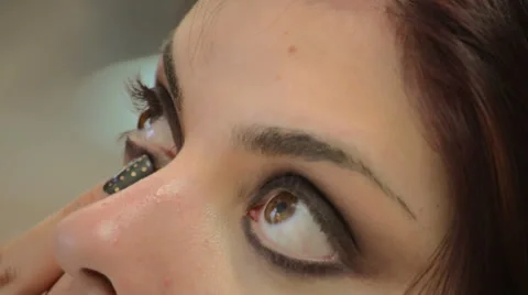 Makeup artist working on model Video stock 43978272