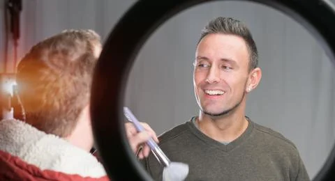 Makeup artist working on models face Stock Photos
