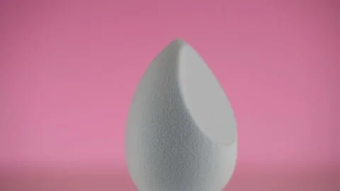 Makeup blue blender sponge, closeup. Foundation beauty facial make-up cosmetics Stock-Footage 228831362