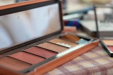 Makeup box at home with multiple skin colored powders Stock Photos