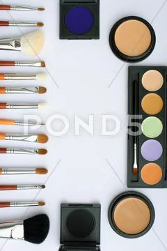Makeup brush and cosmetics, on a white background Stock Photos