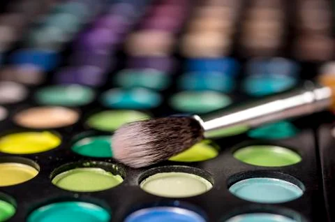 Makeup brush and make-up eye shadows Stock Photos