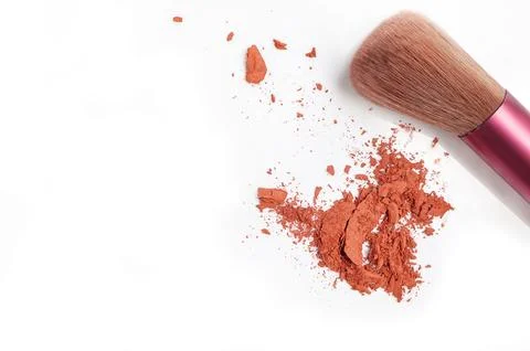 Makeup brush and scattered blush on white background. Space for text,top view Stock Photos