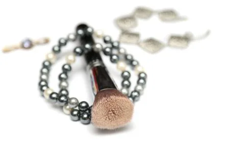 Makeup brush with beading isolated on white background Stock Photos