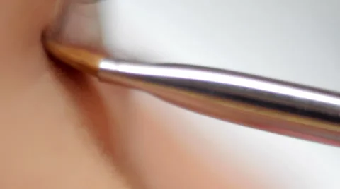 Makeup brush on eye macro Stock Footage 59731031